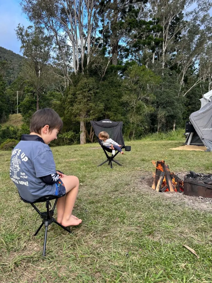 Kid Sitting On Dunn And Watson Camping Swivel Stool